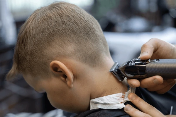 Kid's neckline cleanup with clippers